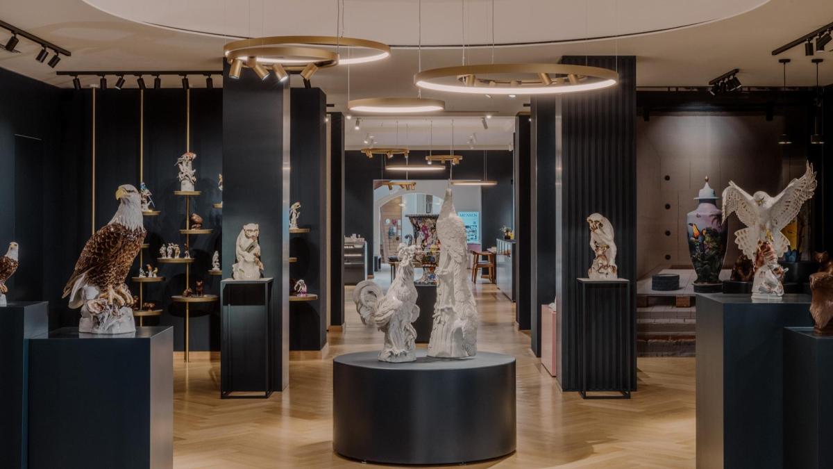 a store filled with sculptures on display in a room