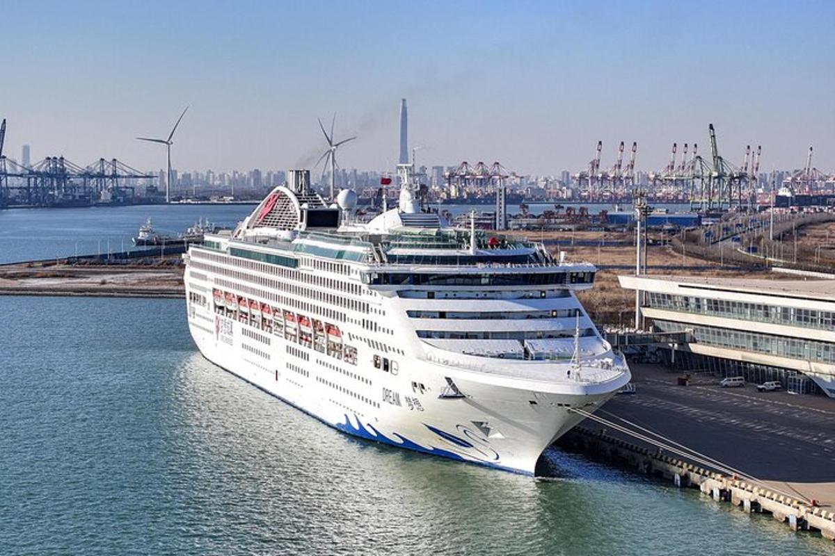 a cruise ship is docked in a harbor