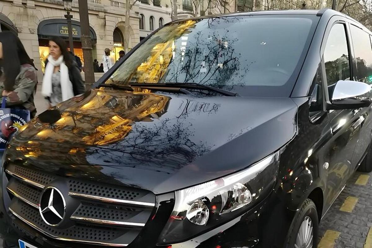 a black van with a smashed windshield on a street