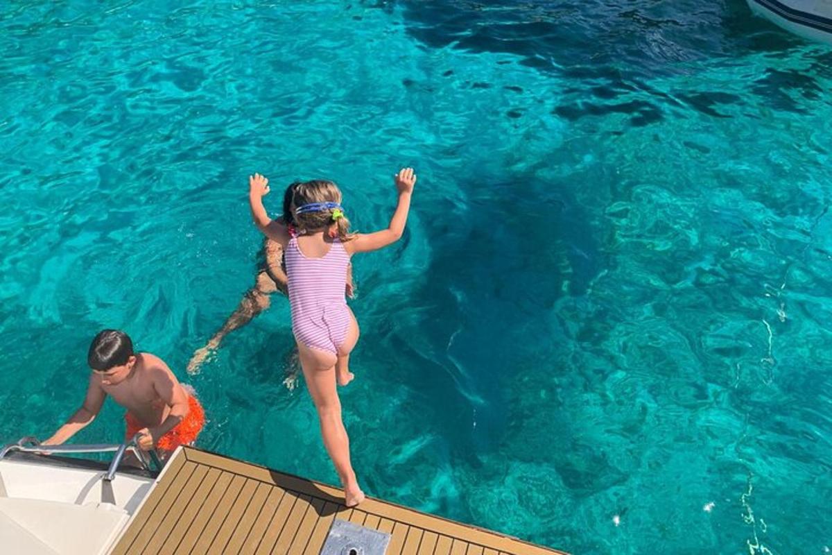 a man and a girl on a boat in the water