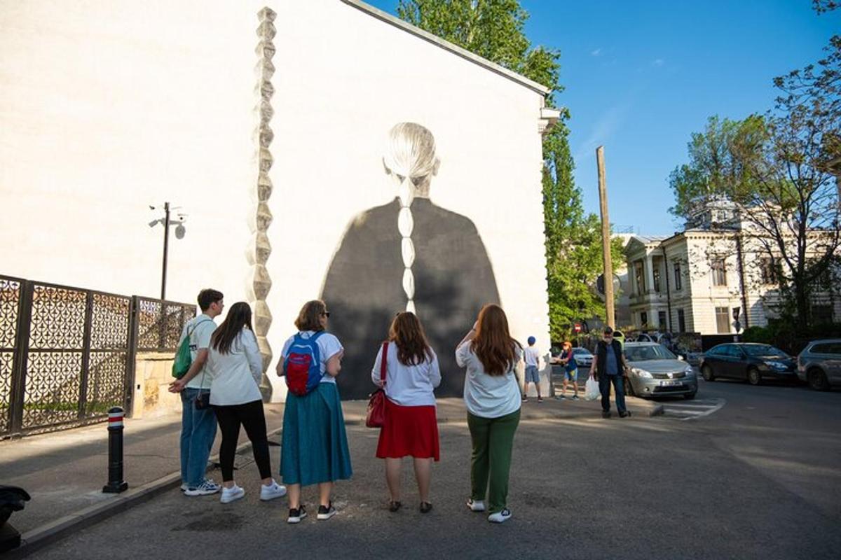 a group of people standing in front of a statue