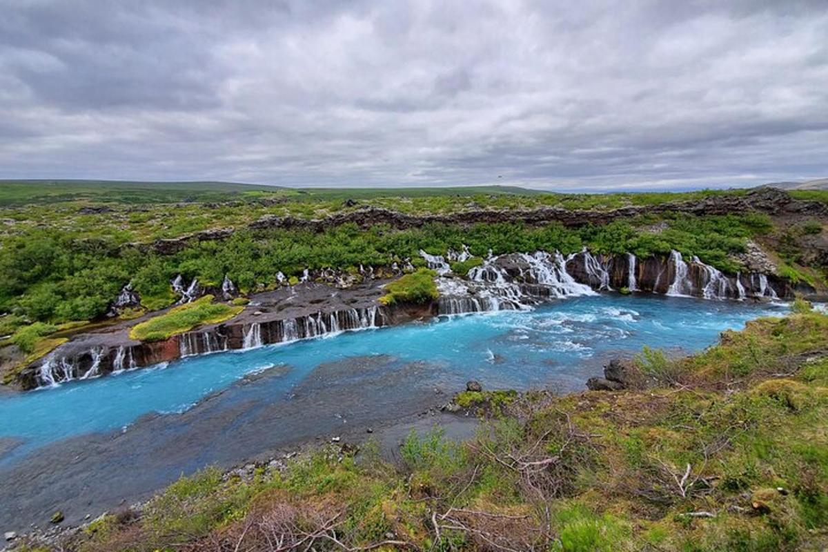 a waterfall in the middle of a river