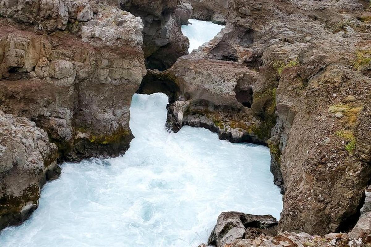 a channel in the side of a mountain with water