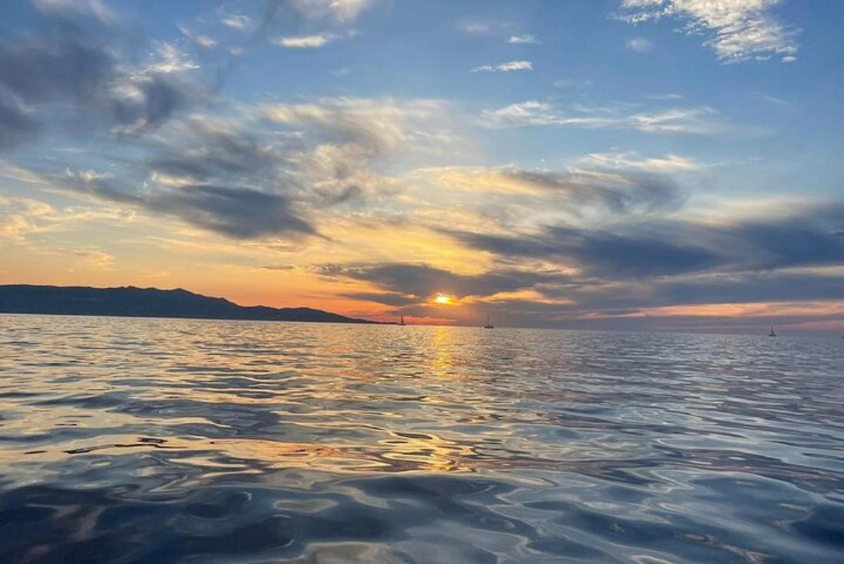 a sunset over a large body of water