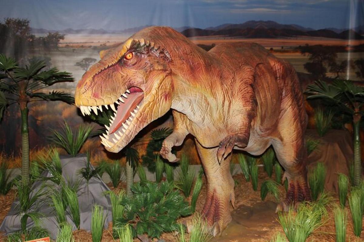 a painting of a dinosaur with its mouth open