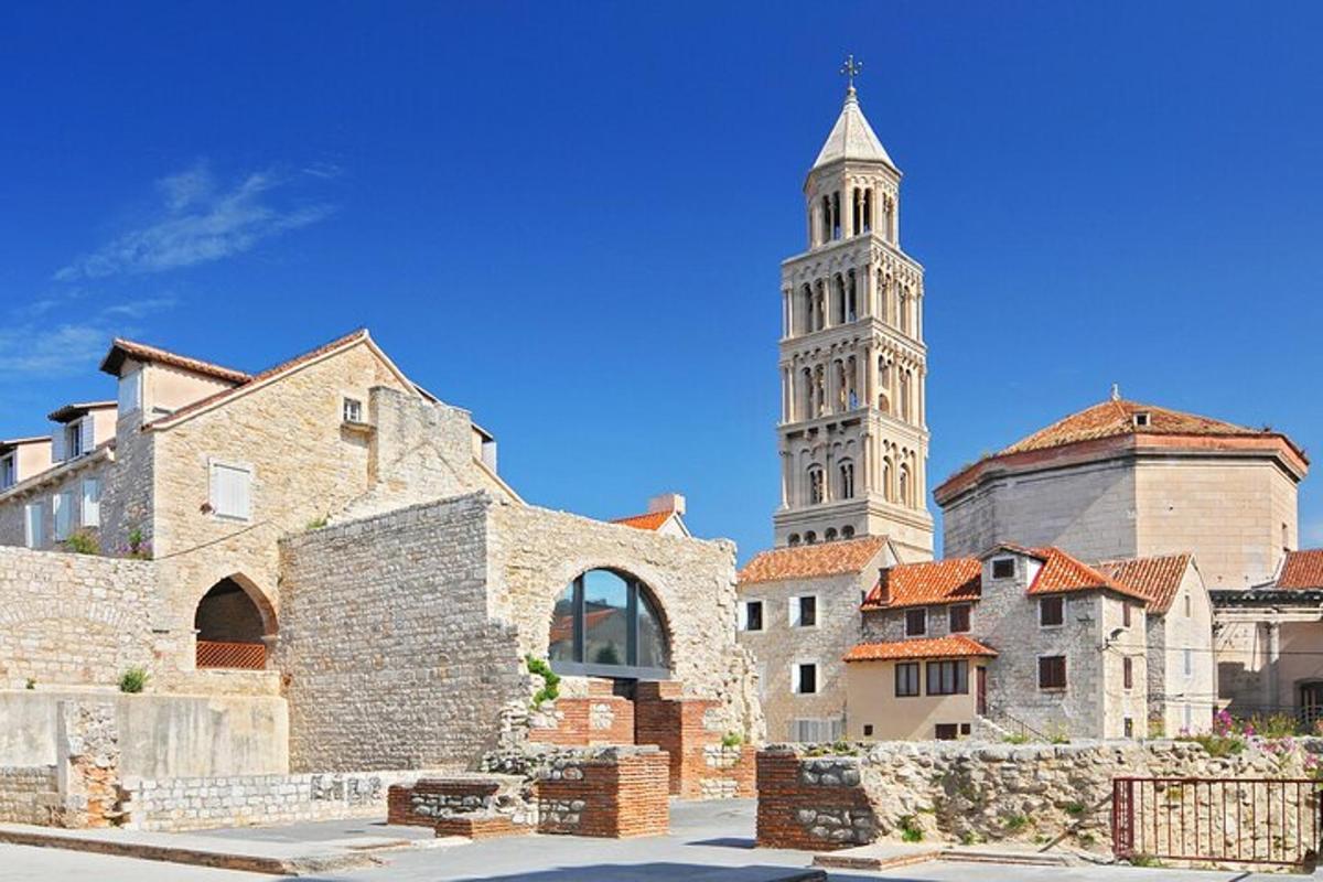 a tall building with a clock tower in a city