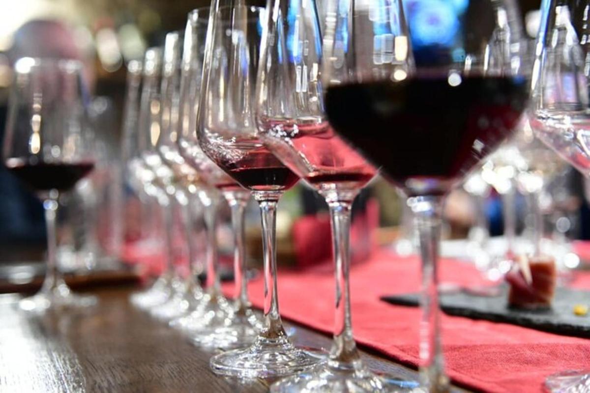 a row of wine glasses sitting on a table