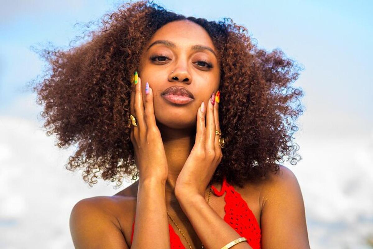 a woman with her hands on her face