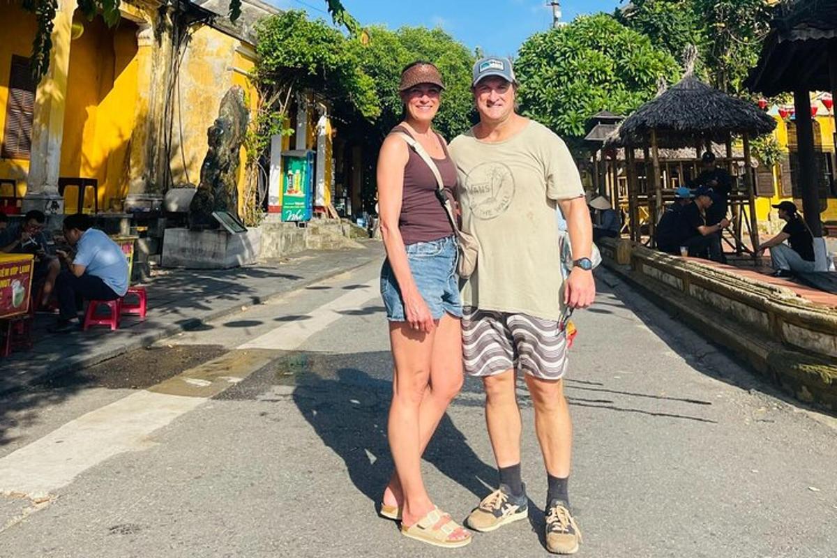 a man and a woman standing in a street