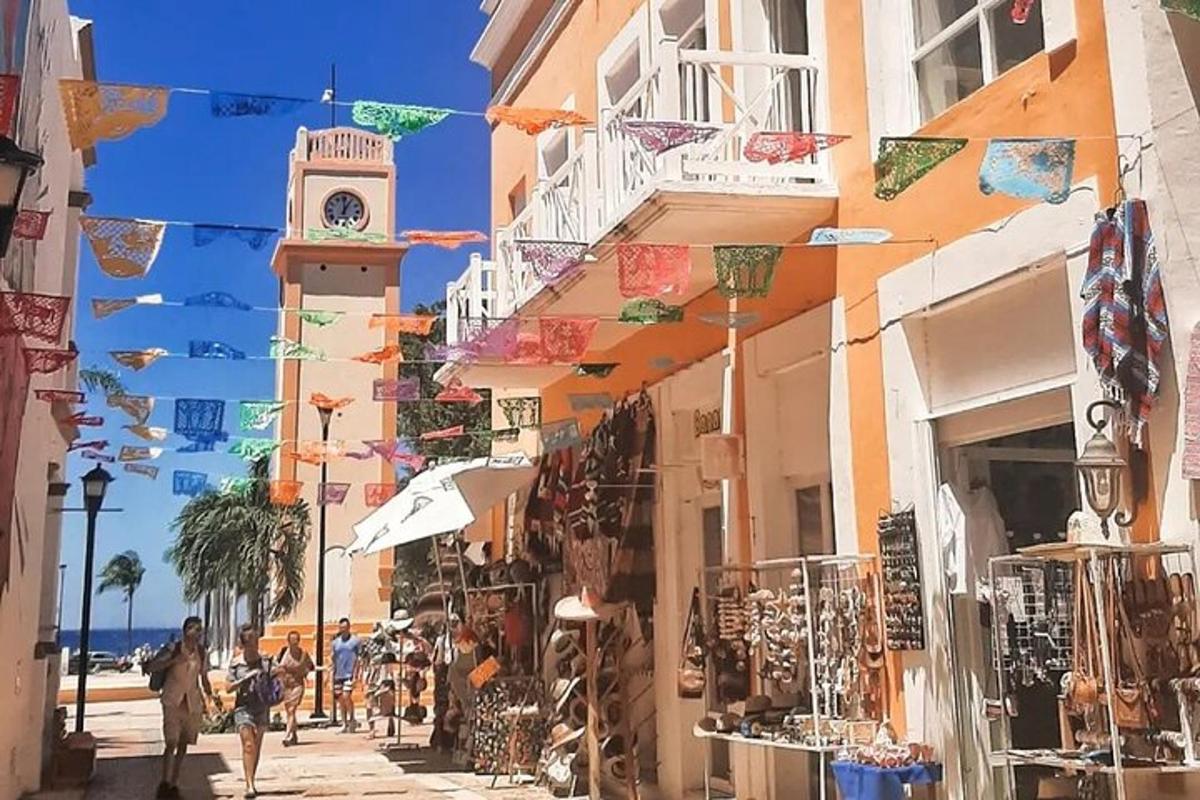 a street with a clock tower and a street with shops