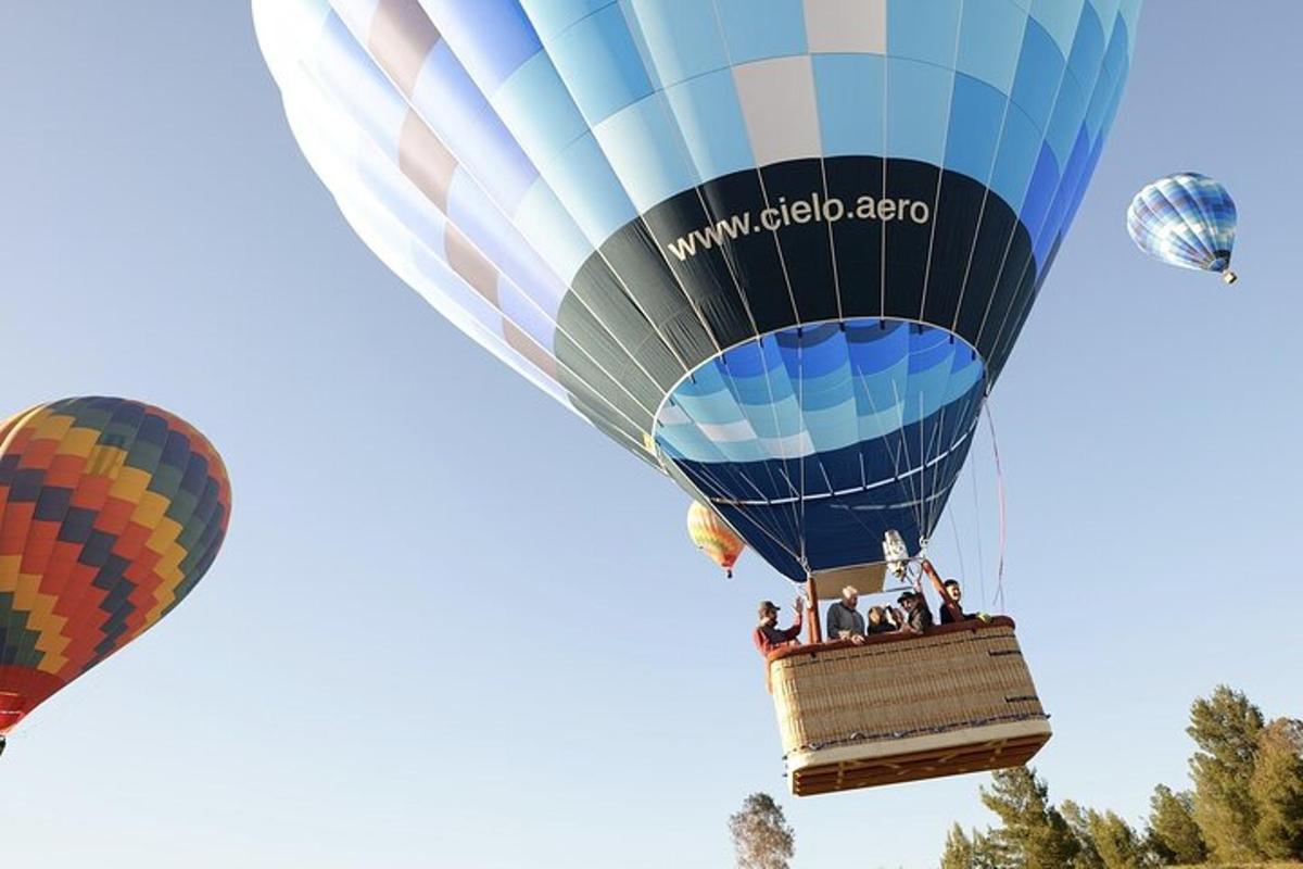 a group of people riding on a hot air balloon