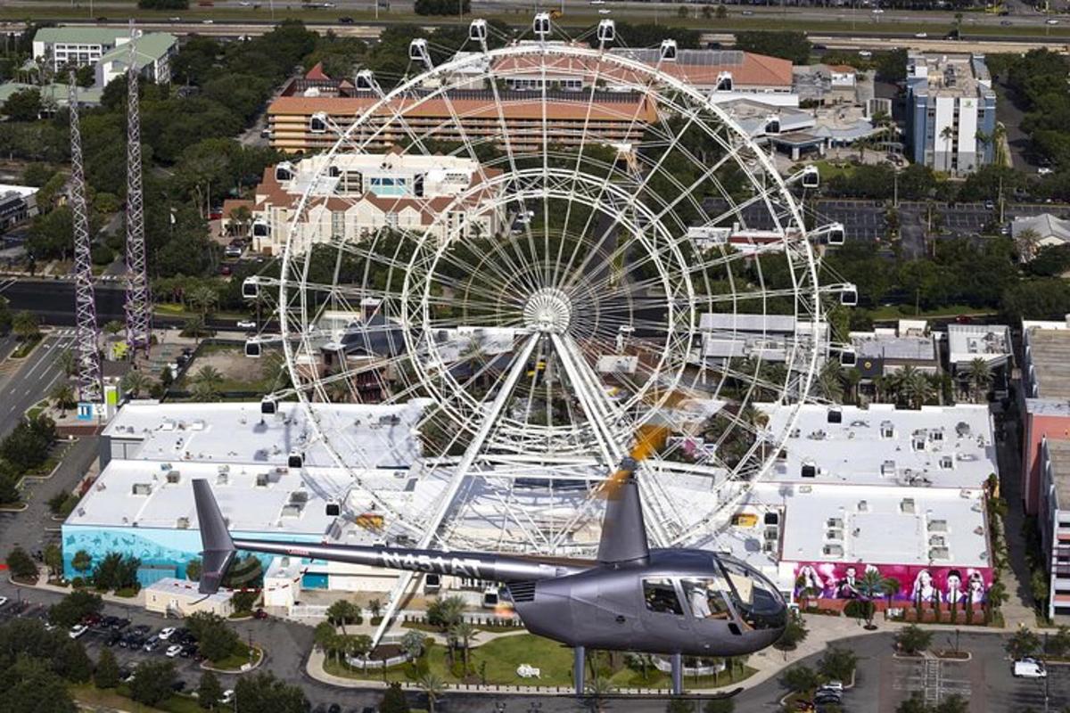 a helicopter is flying next to a ferris wheel