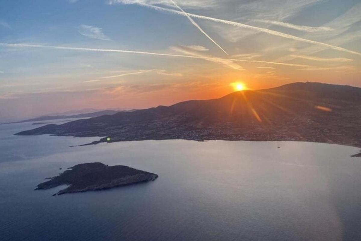 an aerial view of a sunset over a body of water