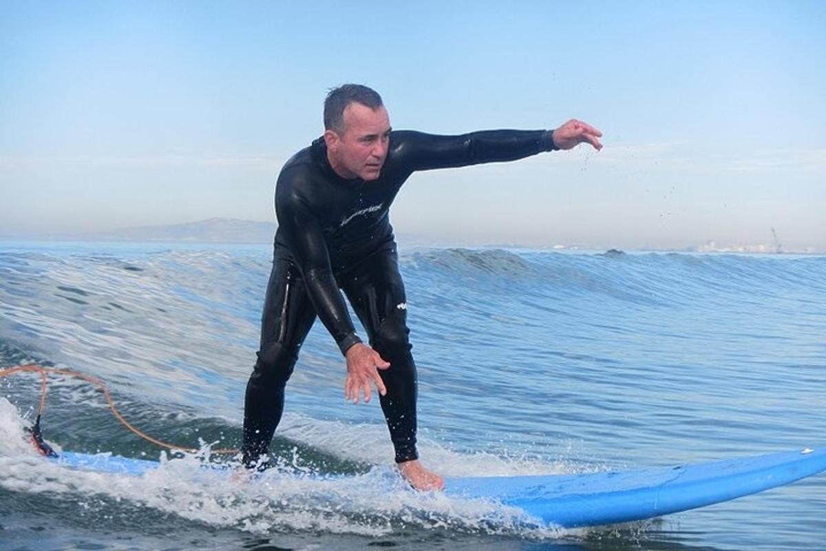 a man riding a wave on a surfboard in the ocean