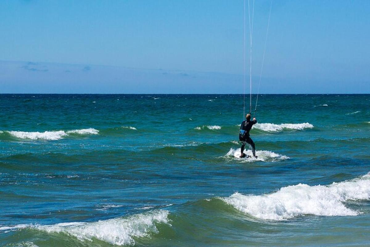 a man is kite surfing in the ocean