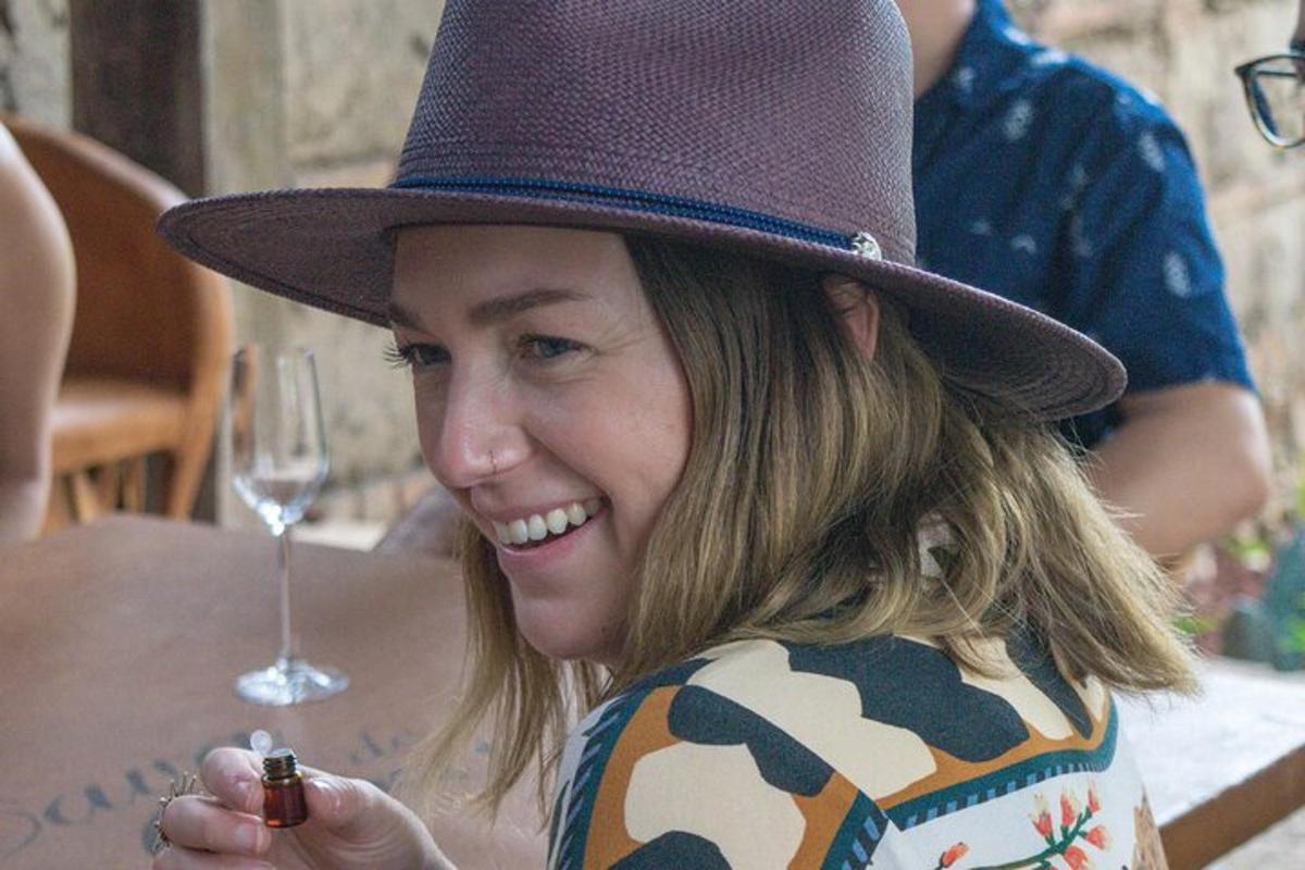 a woman wearing a purple hat sitting at a table