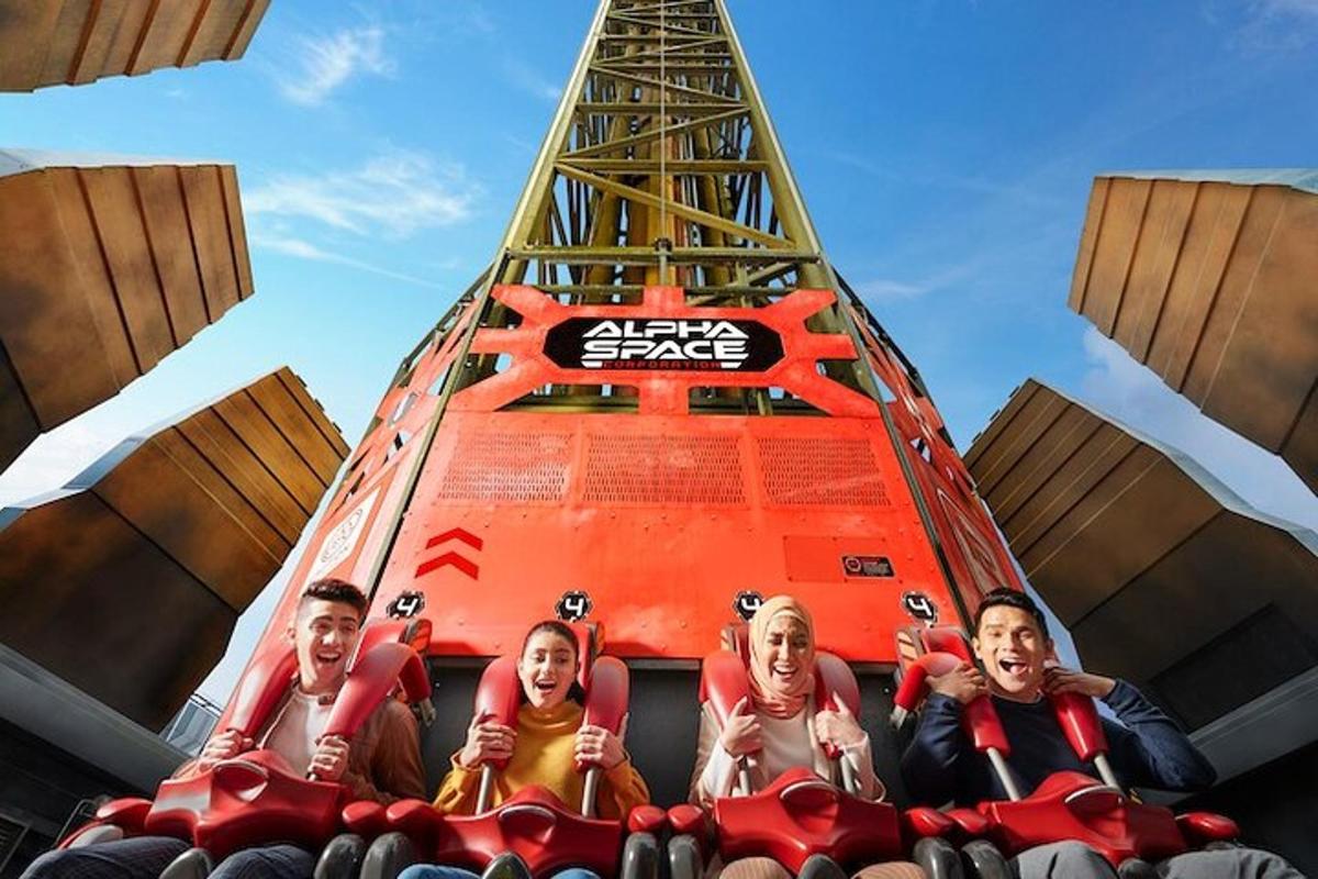 a group of people sitting on a roller coaster
