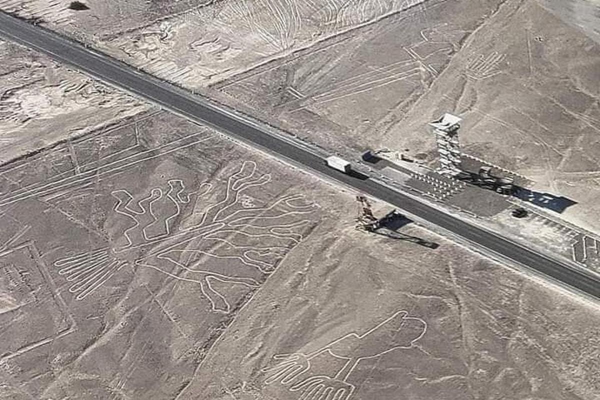 an aerial view of a road with drawings on the ground
