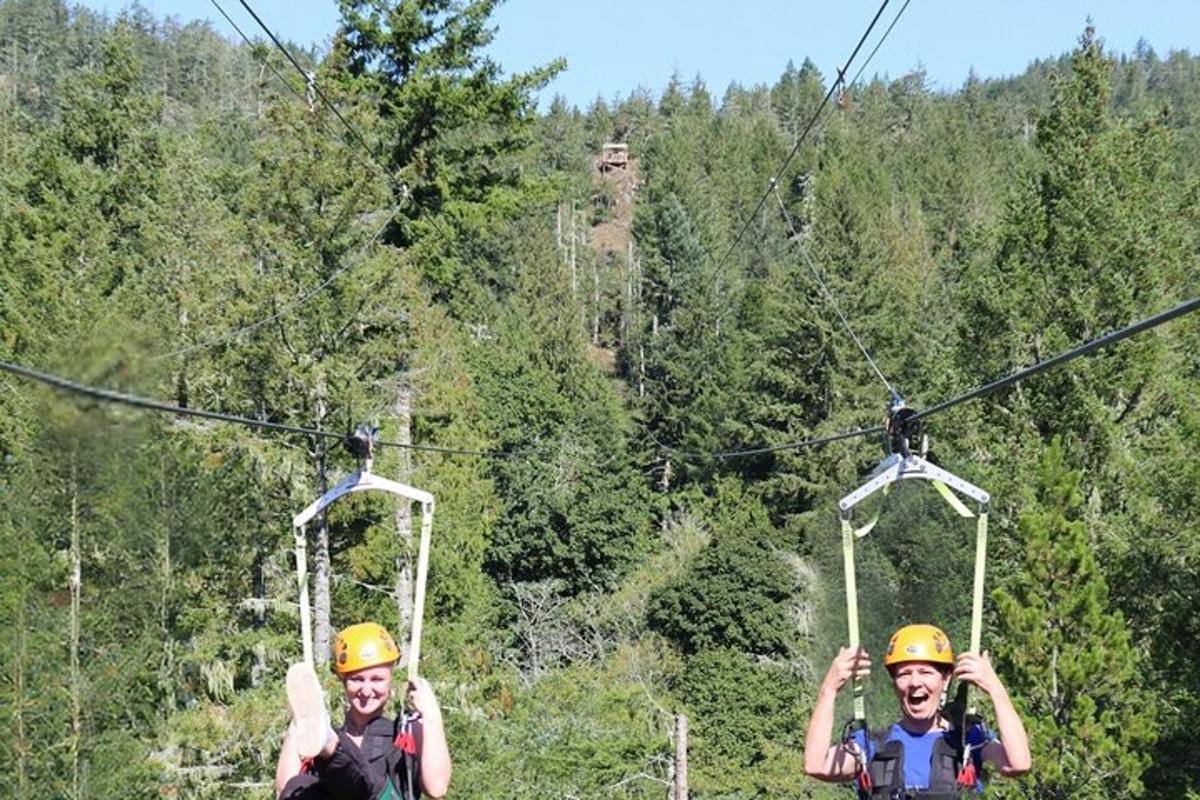 two people are riding on the zip line