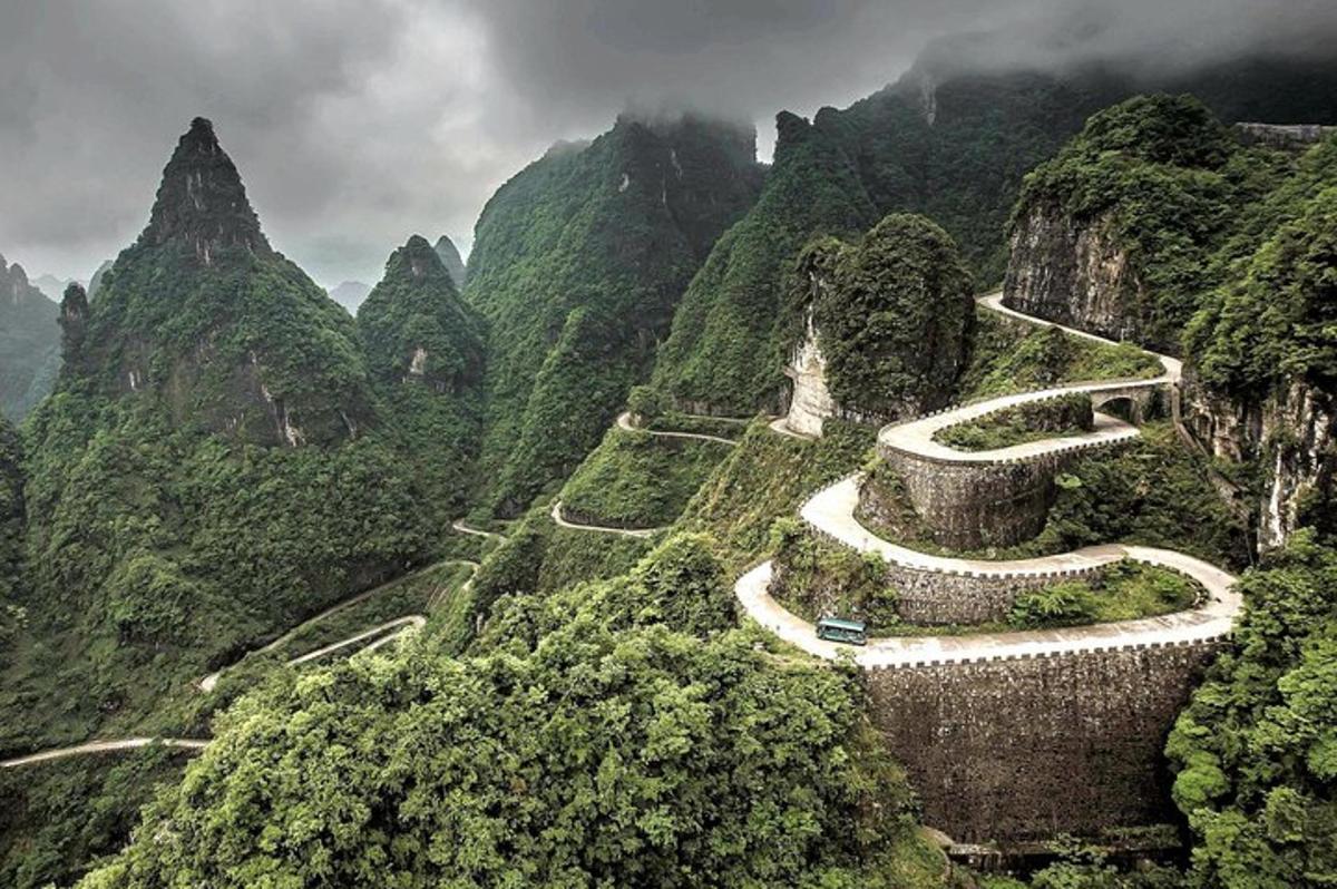 a winding road on the side of a mountain