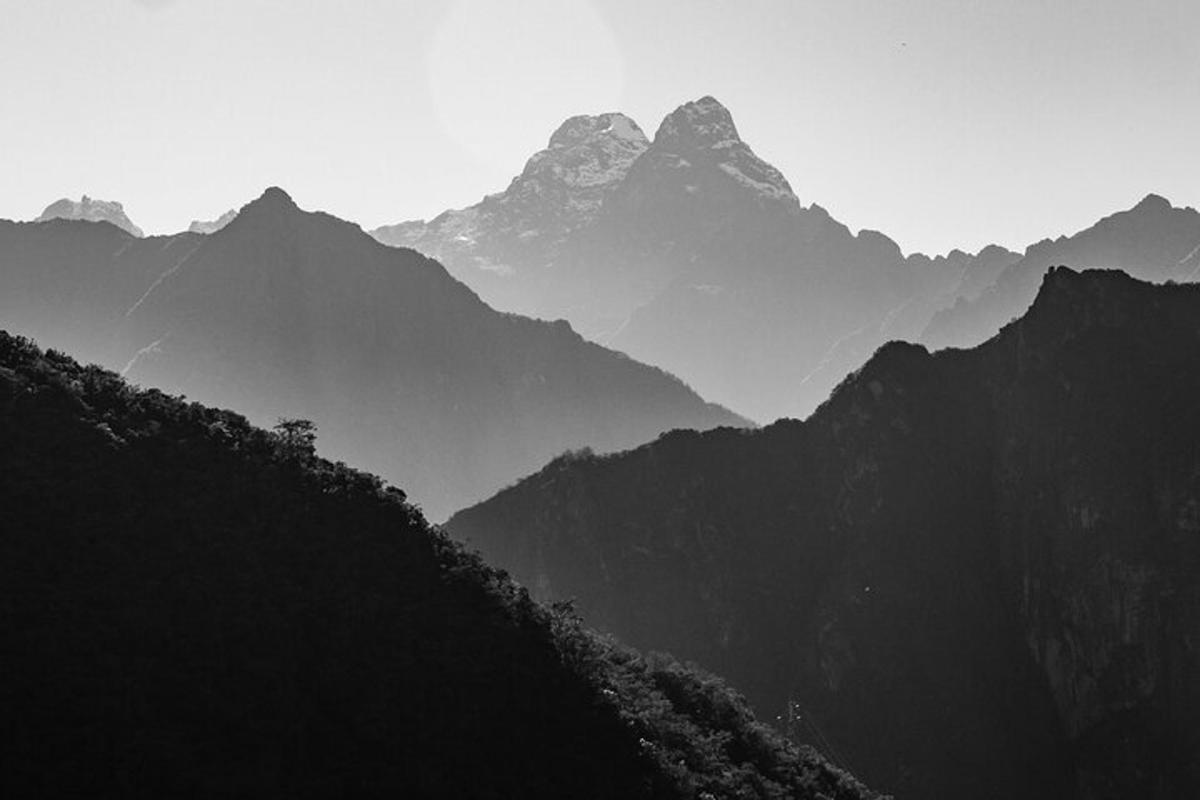 a black and white photo of a mountain range