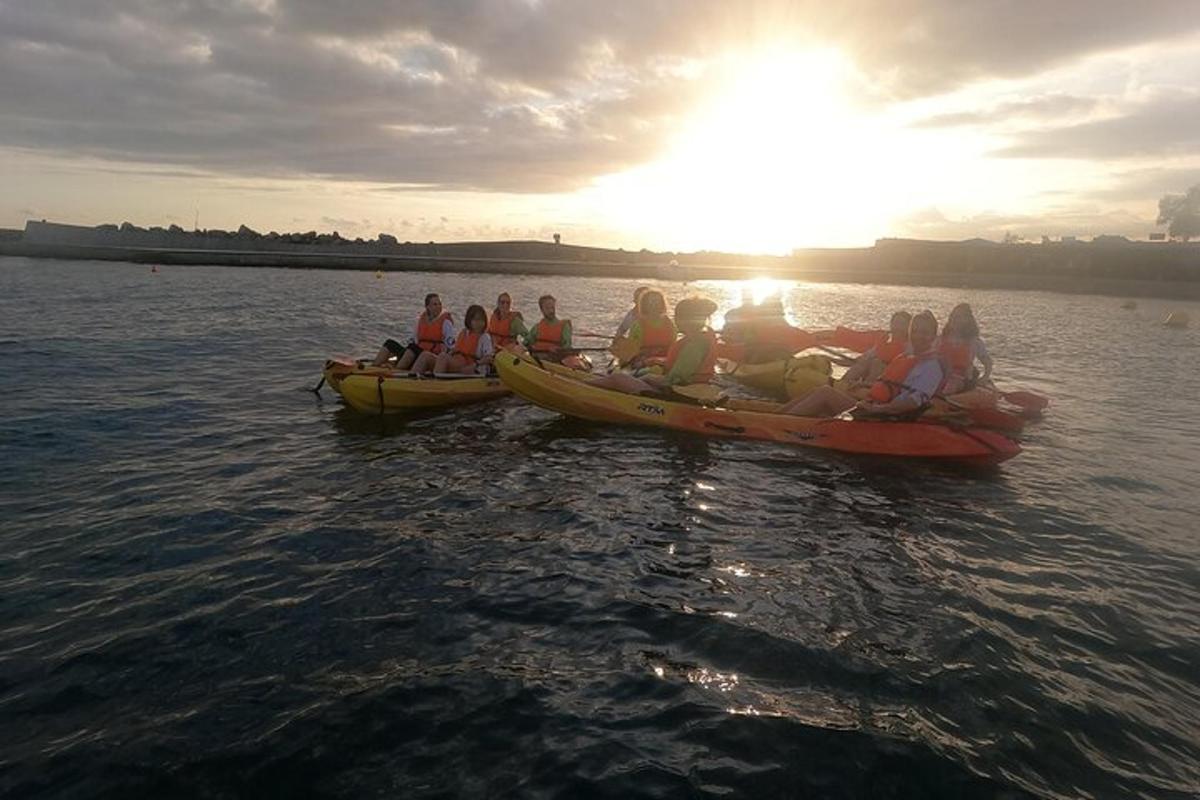 a group of people in canoes in the water