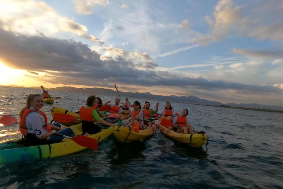 a group of people in kayaks in the water