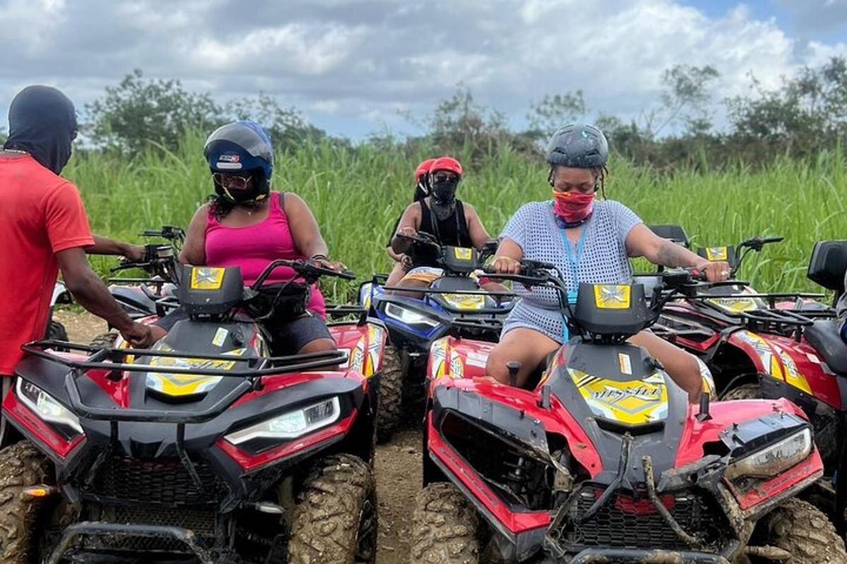 isang grupo ng mga tao na nakasakay sa mga atv sa isang field