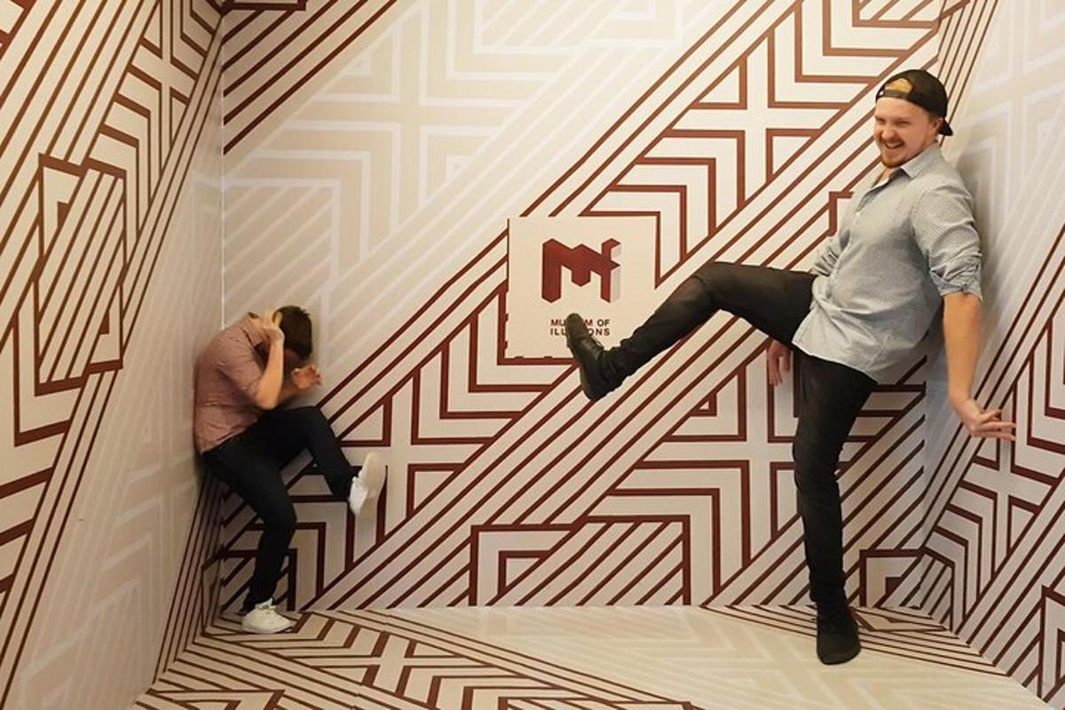 a man and a woman in a room with a wall