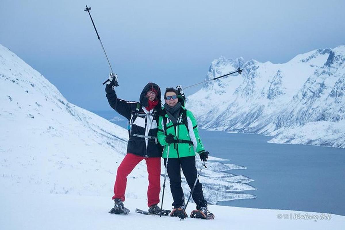 two people posing for a picture in the snow
