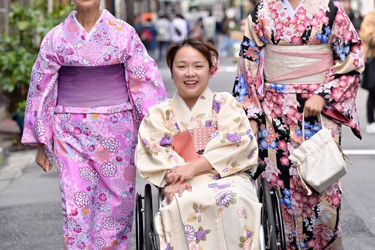a woman in a wheelchair with two other women