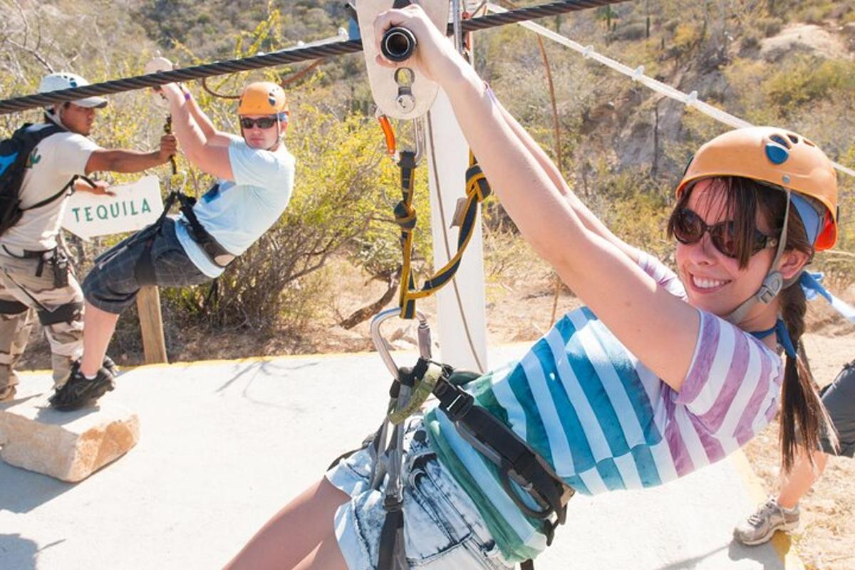 a girl on a zip line with a boy