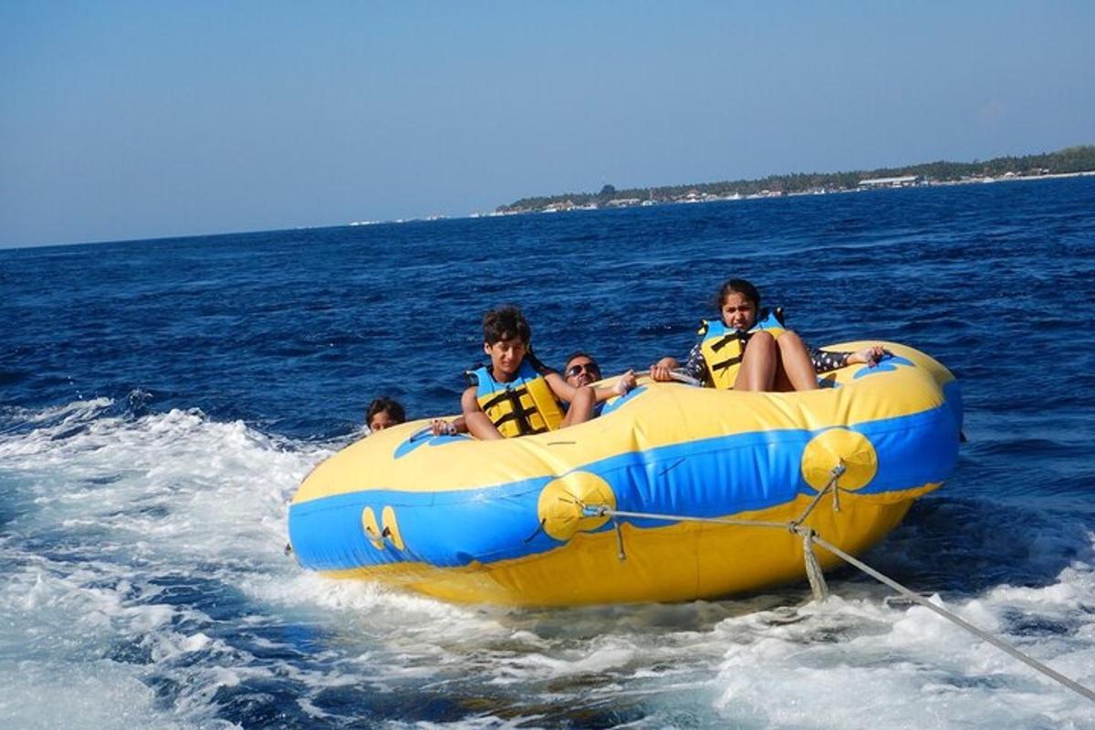 a group of people in a yellow raft in the water