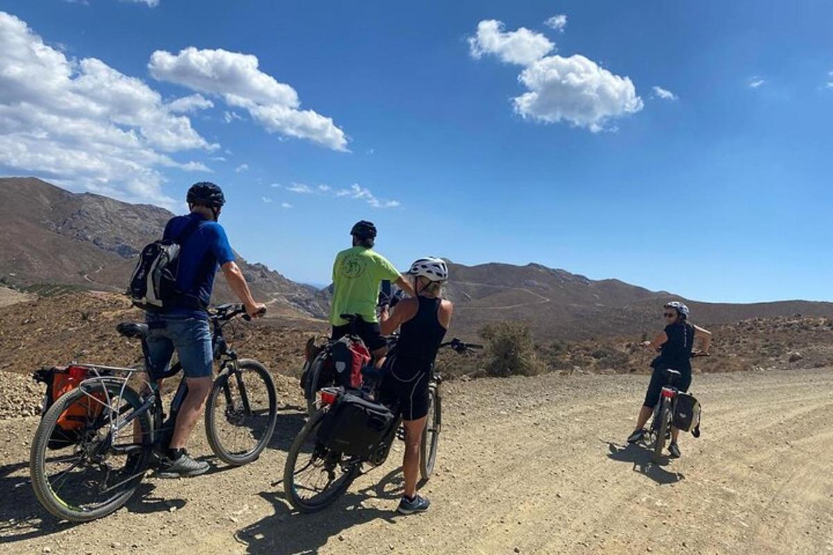 a group of people on bikes on a dirt road