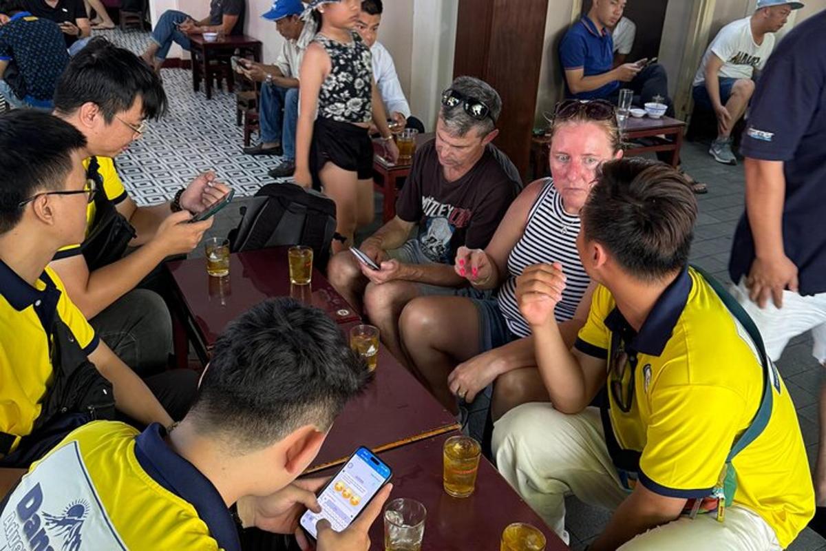 a group of people sitting around a table together