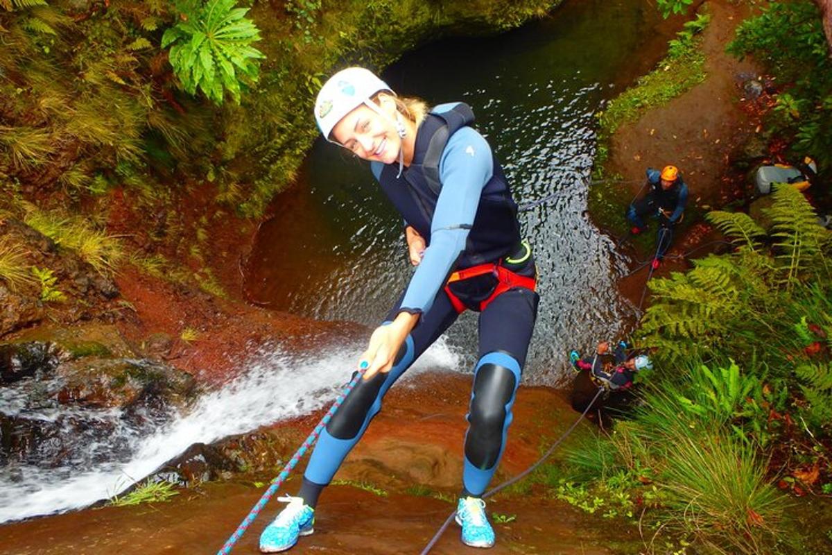 a woman is standing on a board in a river