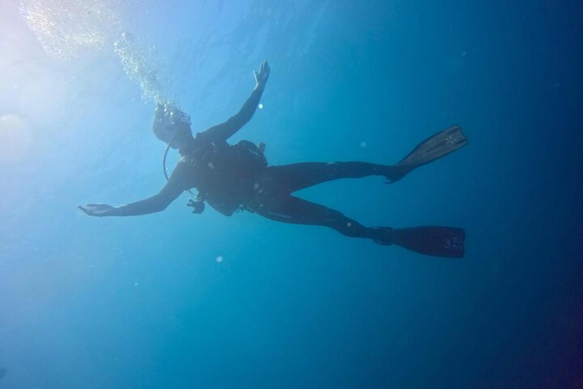 a woman swimming in the water in the ocean