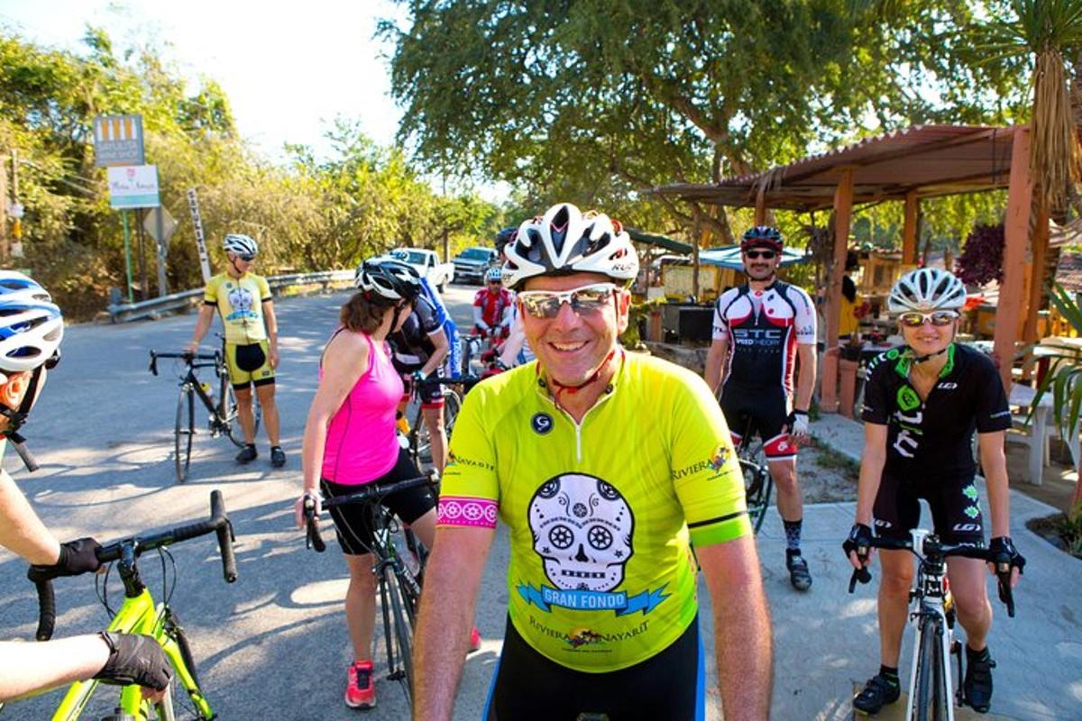 a group of people riding bikes down a street