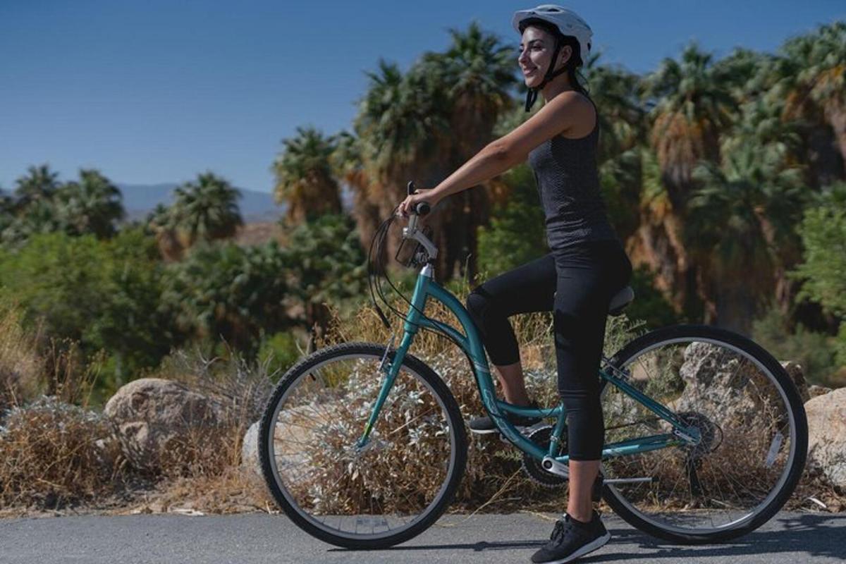 a woman riding a bike on a road