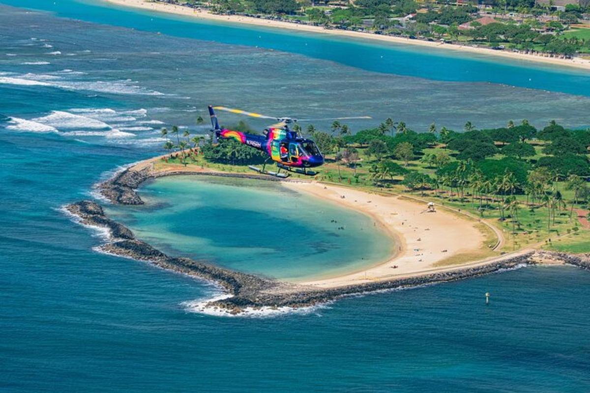 a helicopter flying over an island in the ocean