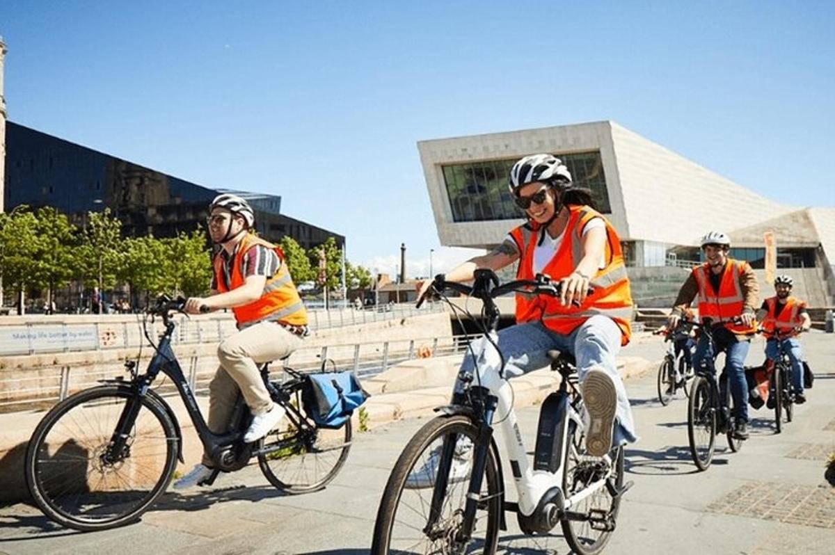 a group of people riding bikes down a street