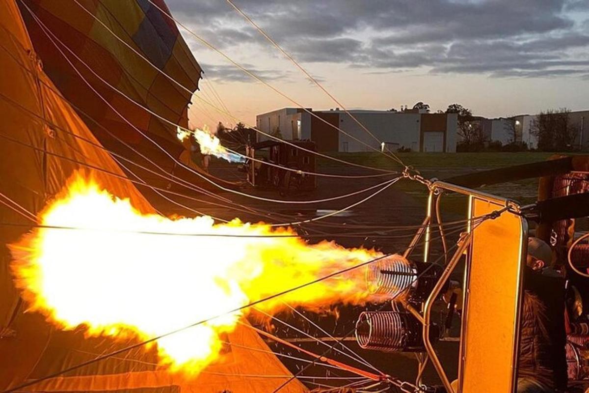 a person is holding a fire in a tent