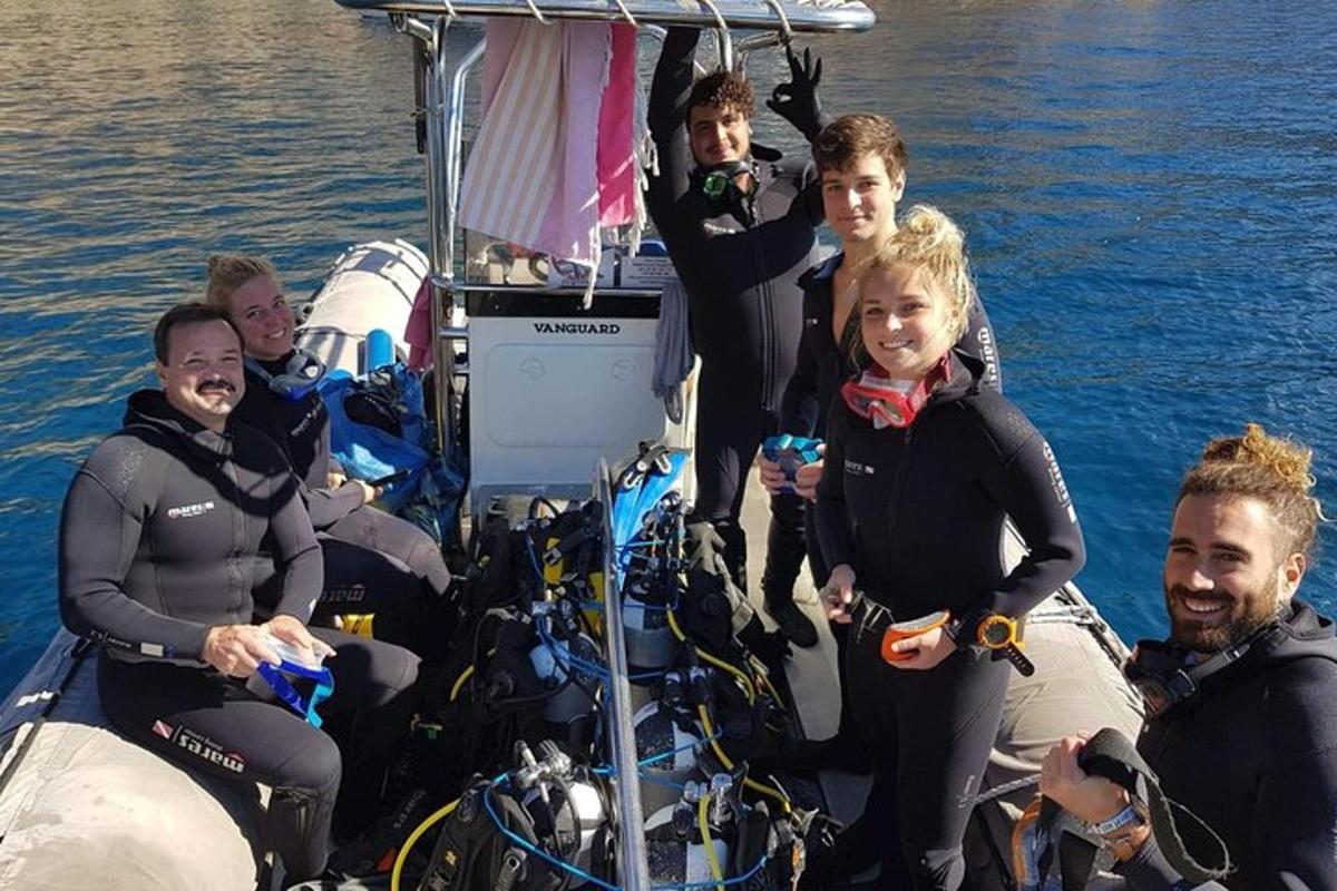 a group of people on a boat in the water