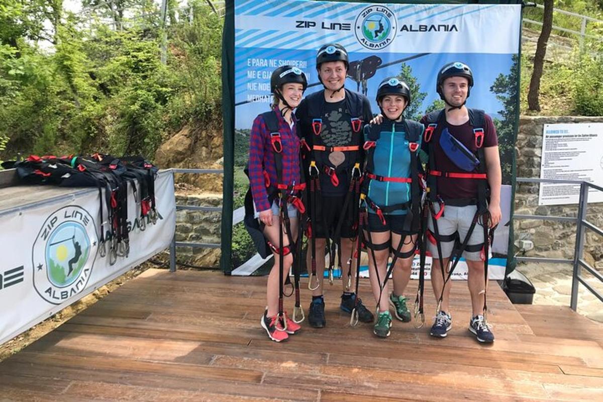 a group of people posing for a picture on a bridge