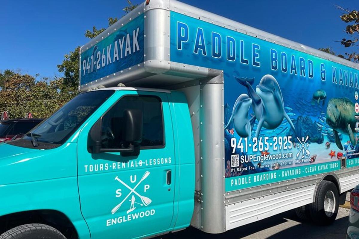 a blue truck parked in a parking lot