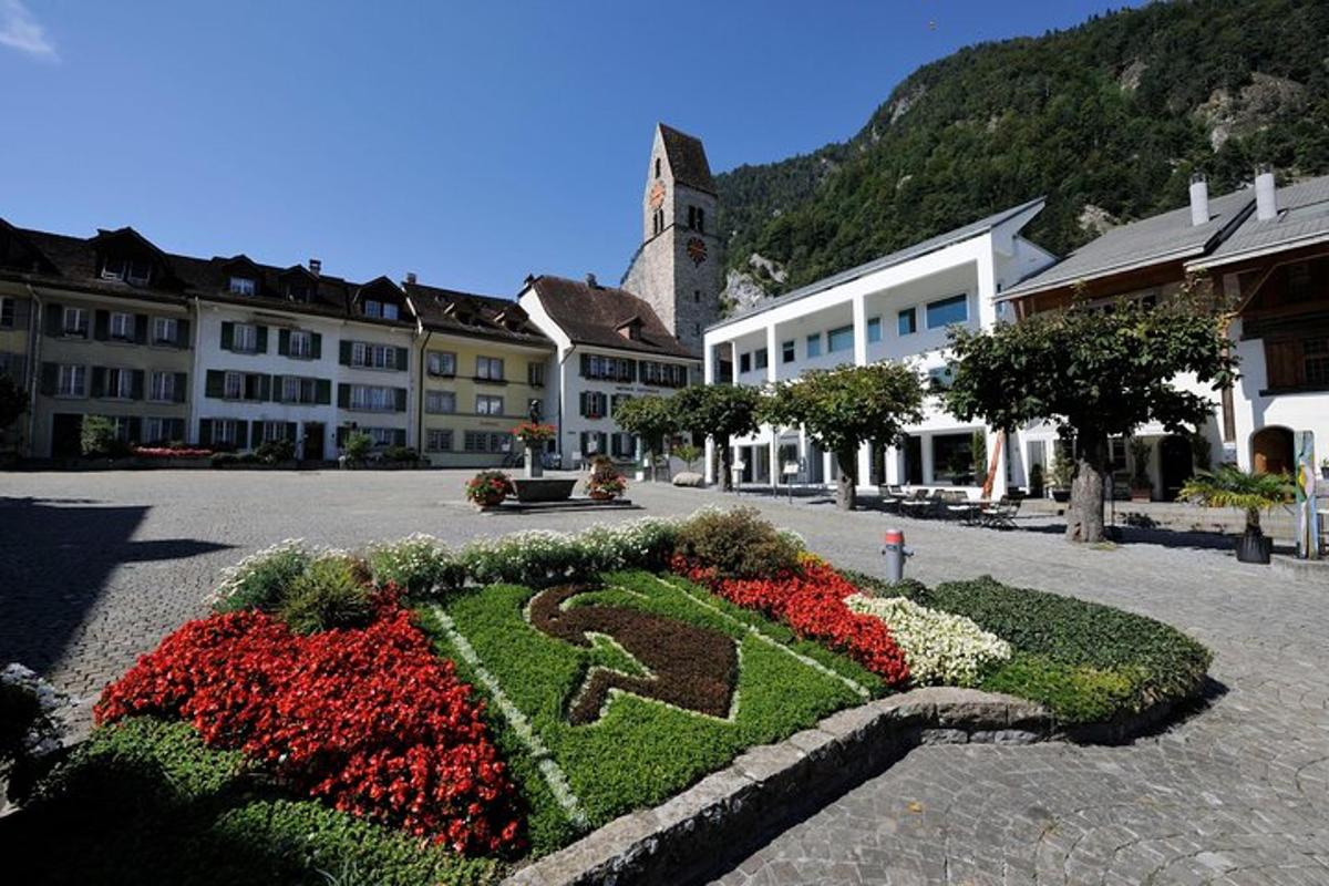 a garden with a horse in the middle of a town
