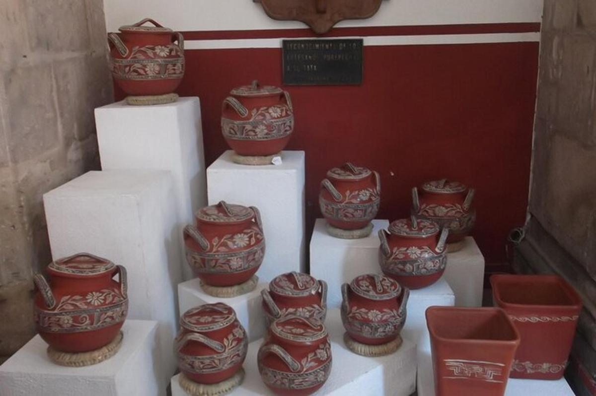 a group of red and white vases sitting on steps