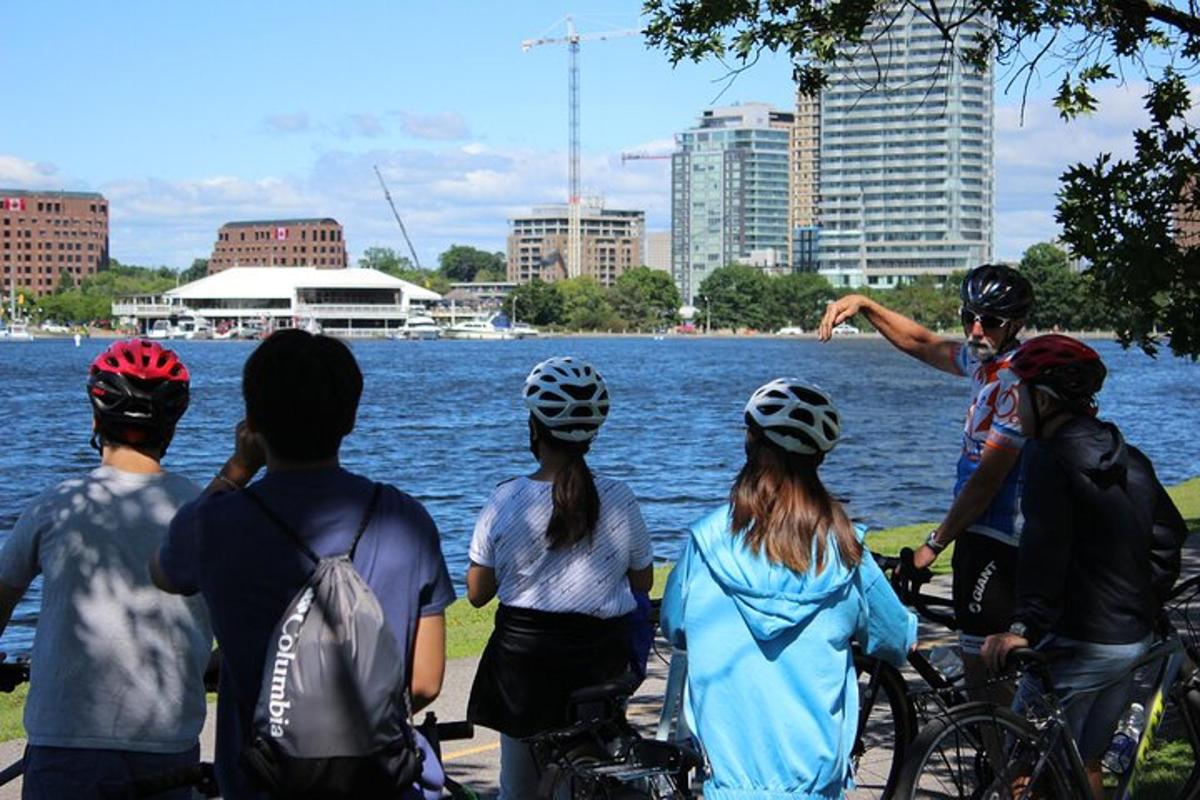 a group of people on bikes looking at the water
