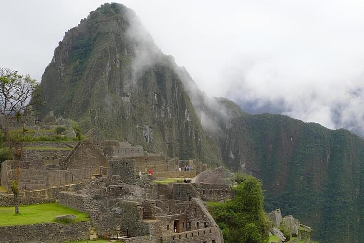 a view of a mountain with a mist covered mountain