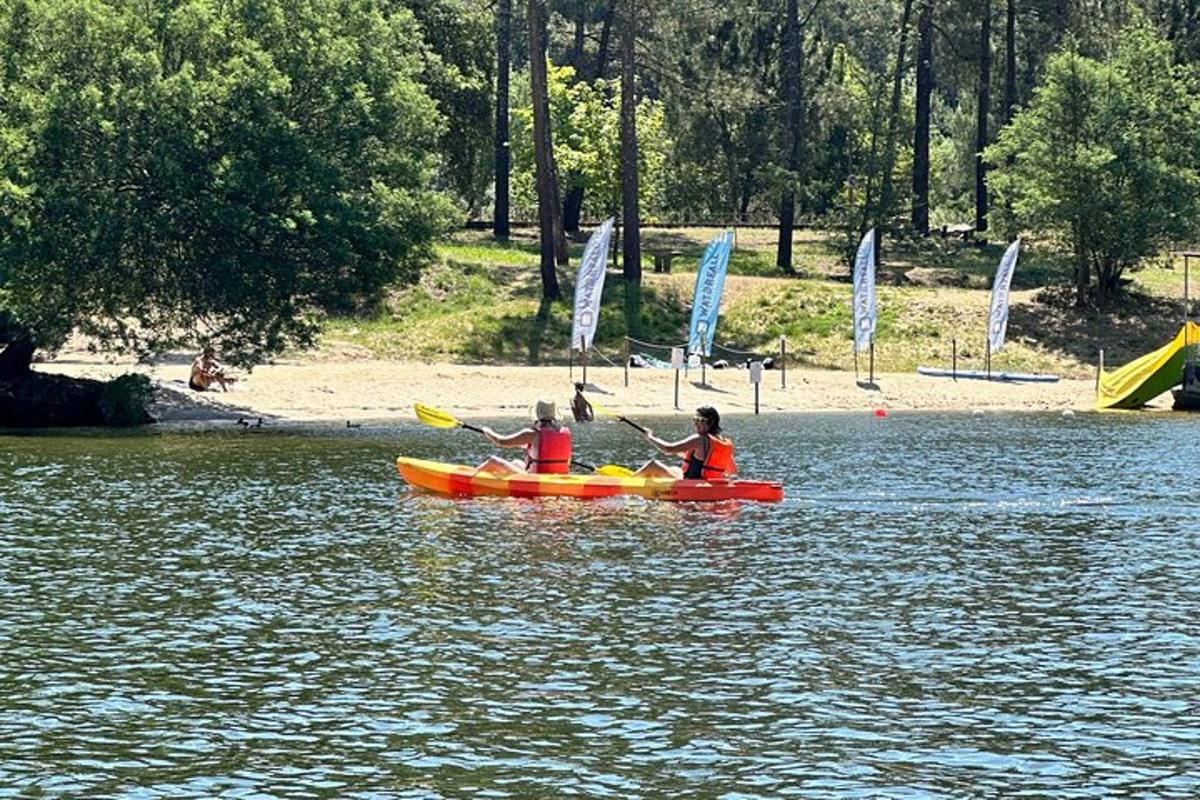 two people are in a kayak in the water